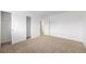 Bedroom features neutral carpet, white walls, and a closet offering storage at 14190 E Gunnison Pl, Aurora, CO 80012