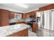 Stylish kitchen boasts granite countertops, stainless steel appliances, and custom cabinetry at 14190 E Gunnison Pl, Aurora, CO 80012