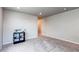 This bedroom includes neutral paint and carpet, recessed lighting, and a door to another room at 5152 Bittercress Rd, Brighton, CO 80640