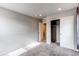 This bedroom has neutral paint and carpet, recessed lighting, and a closet with sliding doors at 5152 Bittercress Rd, Brighton, CO 80640