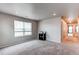 This spacious carpeted bedroom includes a window, an overhead light, and a closet at 5152 Bittercress Rd, Brighton, CO 80640
