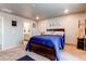 This bedroom features neutral carpet, plenty of light and includes a convenient ensuite bathroom at 5152 Bittercress Rd, Brighton, CO 80640