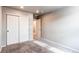 This empty bedroom has neutral carpet, white walls, and a large closet perfect for storage at 5152 Bittercress Rd, Brighton, CO 80640