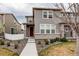 Charming two-story home with neutral siding, brick accents, a walkway and manicured landscaping at 5152 Bittercress Rd, Brighton, CO 80640