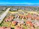 An aerial view showcases a community with well-maintained homes and easy access to major roads at 9588 Firenze Way, Highlands Ranch, CO 80126