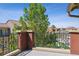 Balcony view of the community, featuring wrought iron railings and a view of the manicured landscape at 9588 Firenze Way, Highlands Ranch, CO 80126