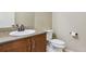 Tastefully designed half bathroom featuring a pedestal sink, modern fixtures, and tiled accents at 9588 Firenze Way, Highlands Ranch, CO 80126