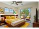 Comfortable bedroom with a private balcony and plenty of natural light at 9588 Firenze Way, Highlands Ranch, CO 80126