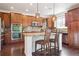 Stylish kitchen showcasing granite countertops, stainless steel appliances, ample cabinet space, and a center island at 9588 Firenze Way, Highlands Ranch, CO 80126