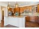 Well-appointed kitchen featuring stainless steel appliances, granite countertops, and decorative pendant lighting at 9588 Firenze Way, Highlands Ranch, CO 80126