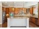 Beautiful kitchen featuring stainless steel appliances, a center island, and stylish pendant lighting fixtures at 9588 Firenze Way, Highlands Ranch, CO 80126
