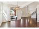 Bright living room with high ceilings, hardwood floors, and access to an outdoor balcony at 9588 Firenze Way, Highlands Ranch, CO 80126