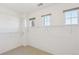 Walk-in closet featuring wall-mounted shelving and windows at 9588 Firenze Way, Highlands Ranch, CO 80126