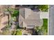 Aerial view of a single-Gathering home with a well-maintained roof and a landscaped backyard at 22 Apache Plume St, Brighton, CO 80601