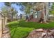 Expansive backyard with lush green lawn and a wooden deck, perfect for outdoor entertaining at 22 Apache Plume St, Brighton, CO 80601