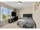 Bedroom with a window, TV, and closet offering a simple yet functional design at 22 Apache Plume St, Brighton, CO 80601
