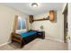 Cozy bedroom with carpet, a window, shelving, and a dark bed providing a comfortable and inviting space at 22 Apache Plume St, Brighton, CO 80601