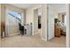 Bedroom with a desk by the window and entry to primary, creating functional and connected spaces at 22 Apache Plume St, Brighton, CO 80601