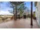 Wooden deck with a pergola, outdoor seating, and a fireplace, ideal for relaxing and entertaining at 22 Apache Plume St, Brighton, CO 80601