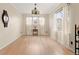 Bright dining room with hardwood floors, white trim, and natural light at 22 Apache Plume St, Brighton, CO 80601