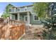 Charming home with a covered front porch and attractive landscaping at 22 Apache Plume St, Brighton, CO 80601