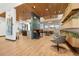 Comfortable lounge area with modern furniture, a breakfast bar, and an open layout at 22 Apache Plume St, Brighton, CO 80601