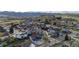 Overhead view of gray home with fenced backyard, lawn, patio, second story balcony, and mountain views at 1353 Quaker St, Golden, CO 80401