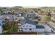 Overhead view of modern gray home with fenced backyard, lawn, patio, and second story balcony at 1353 Quaker St, Golden, CO 80401