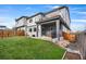 A fenced backyard, patio with grill and a second story balcony complete this modern home at 1353 Quaker St, Golden, CO 80401