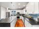 Modern kitchen with stainless steel appliances, granite counters and island with sink at 1353 Quaker St, Golden, CO 80401
