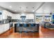 Spacious kitchen features an island with bar seating, stainless steel appliances, and hardwood flooring at 1353 Quaker St, Golden, CO 80401
