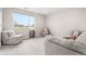 Inviting living room with comfortable gray seating, a large window, and neutral carpeting at 1353 Quaker St, Golden, CO 80401