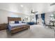 Bright main bedroom with a large bed, private balcony, and ample natural light at 1353 Quaker St, Golden, CO 80401