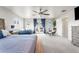 Bright main bedroom featuring a king bed, cozy seating area, and private outdoor balcony at 1353 Quaker St, Golden, CO 80401