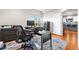 Bright home office with a large window, modern desk, and view into the kitchen at 1353 Quaker St, Golden, CO 80401