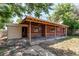 View of the backyard featuring a covered patio area and brick exterior at 9150 Lilly Ct, Thornton, CO 80229