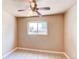 Neutral bedroom with a large window overlooking a tree lined street at 9150 Lilly Ct, Thornton, CO 80229