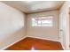 Bright bedroom with hardwood floors and a window bringing in natural light at 9150 Lilly Ct, Thornton, CO 80229