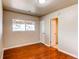 Bedroom featuring wood floors, neutral walls, and window for natural light at 9150 Lilly Ct, Thornton, CO 80229