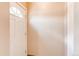 Close up view of a white front door with sidelight at 9150 Lilly Ct, Thornton, CO 80229