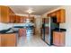 Traditional kitchen featuring stainless steel appliances, tiled floor and plenty of cabinet space at 9150 Lilly Ct, Thornton, CO 80229