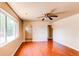 Bright living room with hardwood floors, ceiling fan, and natural light at 9150 Lilly Ct, Thornton, CO 80229