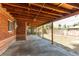 Covered patio with a concrete floor and view to a fenced backyard at 9150 Lilly Ct, Thornton, CO 80229