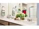 Elegant bathroom featuring a double sink vanity with a quartz countertop and modern fixtures at 15833 Little Bluestem Rd, Monument, CO 80132