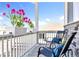 Inviting front porch featuring chairs, accent pillows, and decorative planters creating a relaxing outdoor seating area at 15833 Little Bluestem Rd, Monument, CO 80132