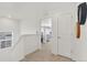 Upstairs hallway leading to a bedroom with soft natural light at 15833 Little Bluestem Rd, Monument, CO 80132