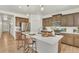 Modern kitchen boasts a spacious center island, stainless steel appliances, and beautiful cabinetry, perfect for gathering at 15833 Little Bluestem Rd, Monument, CO 80132
