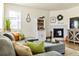 Comfortable living room with gray sofa, fireplace, and stylish decor accents at 15833 Little Bluestem Rd, Monument, CO 80132