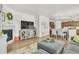 Spacious living room featuring a fireplace, TV, dining area, and kitchen at 15833 Little Bluestem Rd, Monument, CO 80132