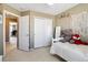 Charming bedroom boasts closet space and is decorated with a teddy bear at 9378 Longstone Dr, Parker, CO 80134